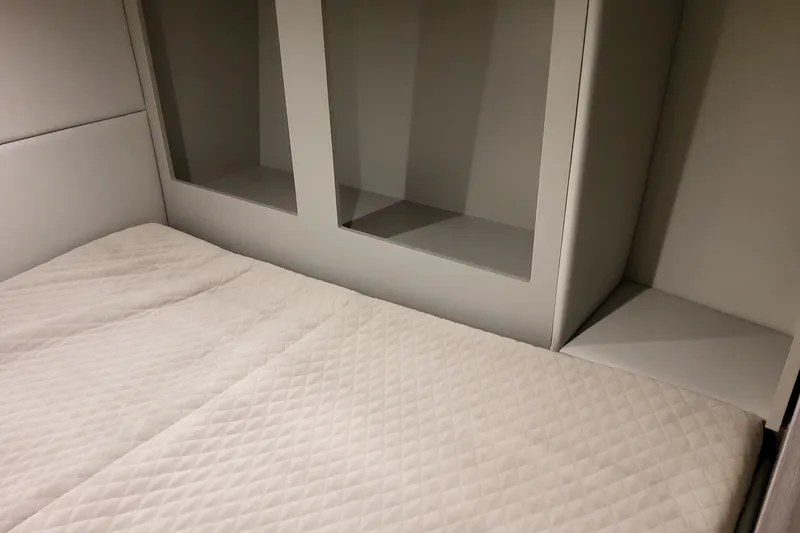 Slide: The Image of Interior cabin of 2026 Formula 380 Super Sport Crossover OB with quilted bedding. - 111