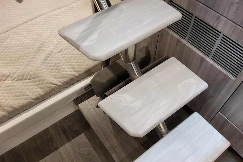 Slide: The Image of 2026 Formula 380 Super Sport Crossover OB interior stairs and bedding detail. - 113