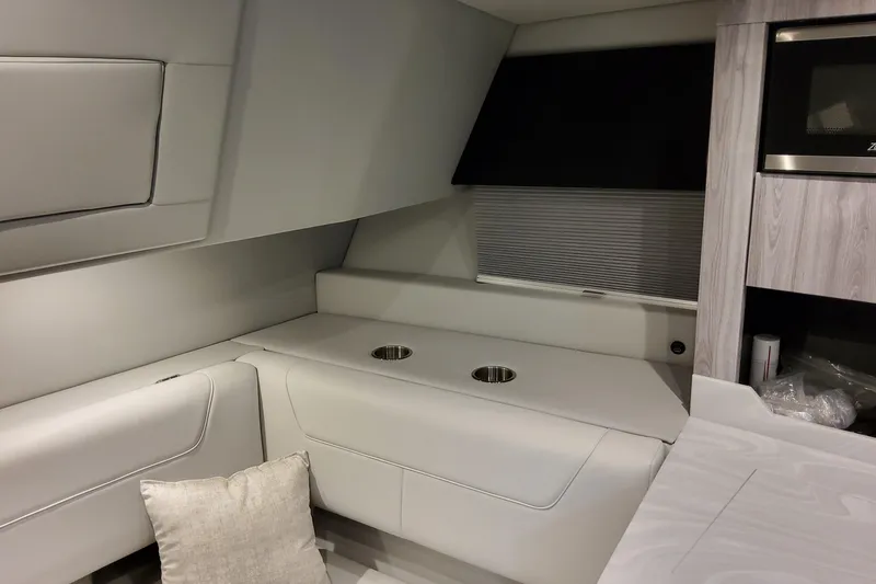 Slide: The Image of Interior of 2026 Formula 380 Super Sport Crossover OB, featuring modern seating and cabinetry. - 118