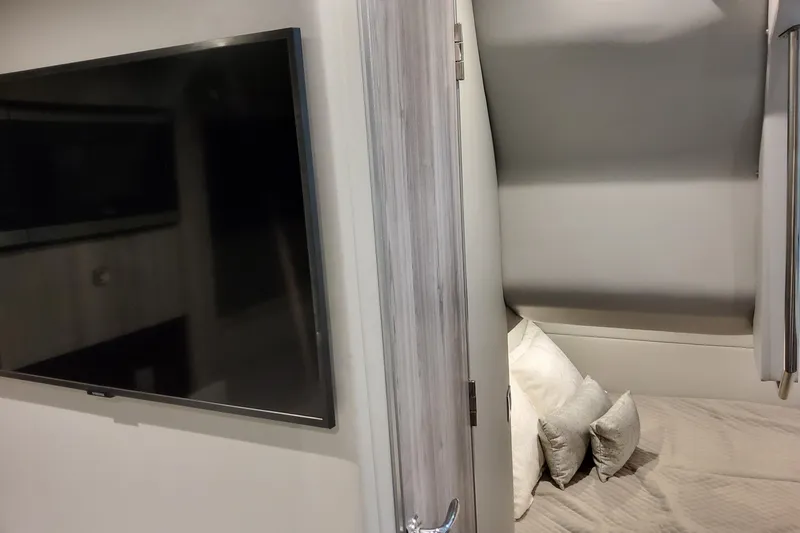 Slide: The Image of Interior of 2026 Formula 380 Super Sport Crossover OB with TV and cozy bed. - 124