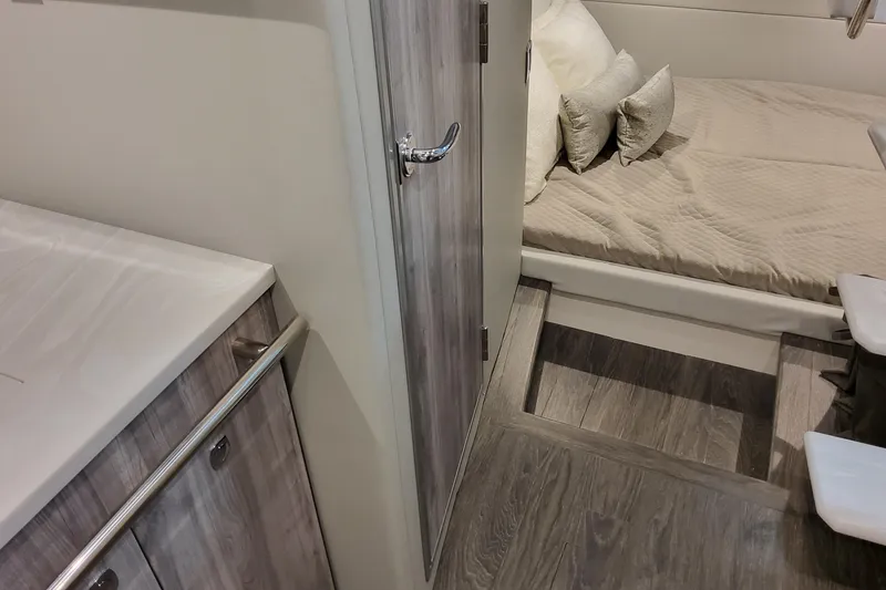 Slide: The Image of Interior of 2026 Formula 380 Super Sport Crossover OB, featuring a cozy cabin bed. - 125