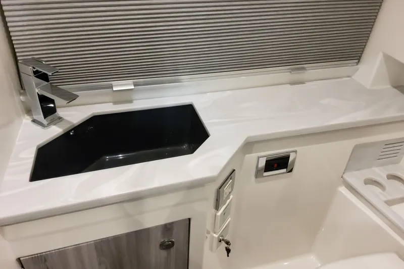 Slide: The Image of Modern sink area in 2026 Formula 380 Super Sport Crossover OB boat. - 128