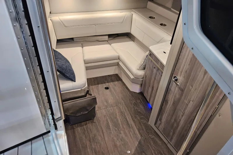 Slide: The Image of Interior of 2026 Formula 380 Super Sport Crossover OB with modern seating and wood flooring. - 13