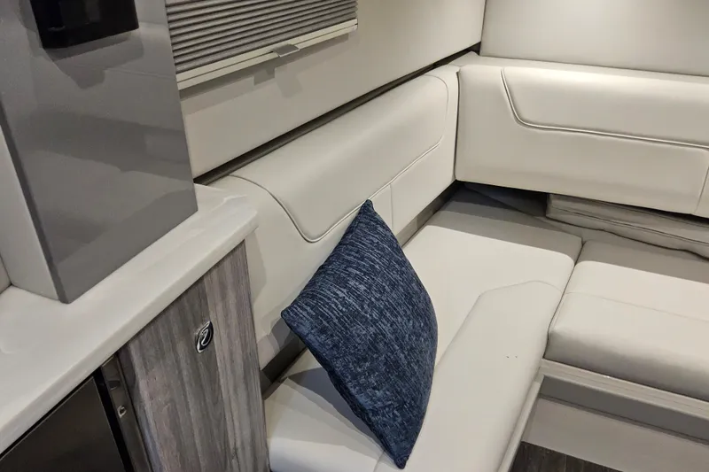 Slide: The Image of Luxurious interior of 2026 Formula 380 Super Sport Crossover OB with white seating and blue cushion. - 14