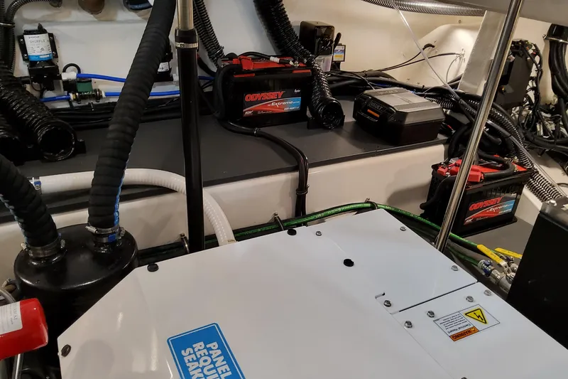 Slide: The Image of Engine room of 2026 Formula 380 Super Sport Crossover OB with batteries and wiring. - 143