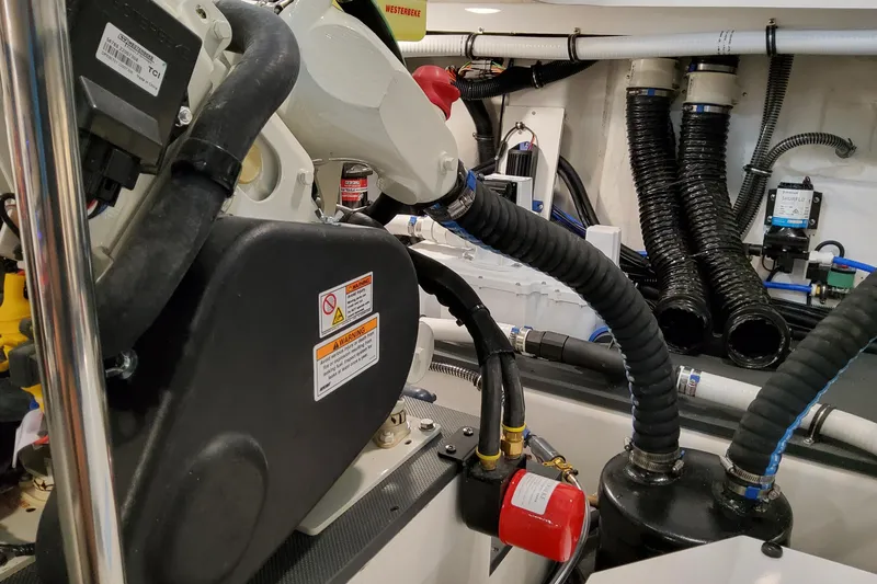 Slide: The Image of Engine compartment of 2026 Formula 380 Super Sport Crossover OB with hoses and components. - 148