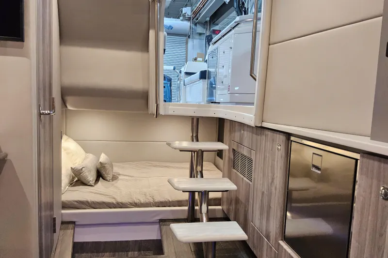 Slide: The Image of Interior of 2026 Formula 380 Super Sport Crossover OB, featuring cozy cabin and modern amenities. - 17