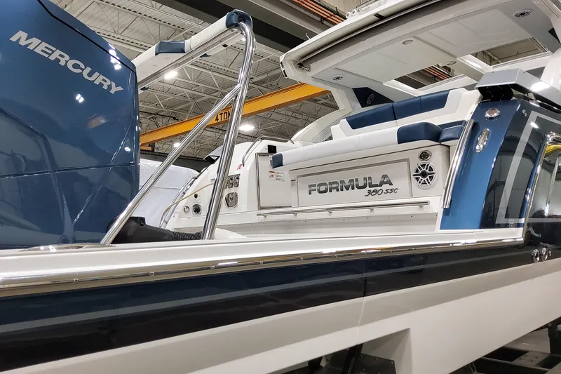 Slide: The Image of 2026 Formula 380 Super Sport Crossover OB boat with Mercury engine in showroom. - 22