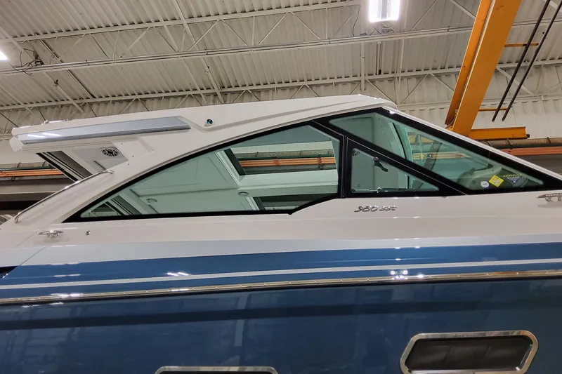 Slide: The Image of 2026 Formula 380 Super Sport Crossover OB boat in a warehouse setting. - 27