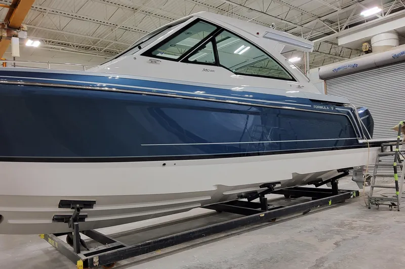 Slide: The Image of 2026 Formula 380 Super Sport Crossover OB in a showroom, side view. - 29