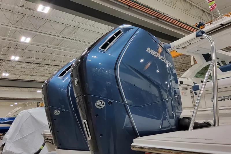 Slide: The Image of 2026 Formula 380 Super Sport Crossover OB with Mercury outboard engines in showroom. - 34