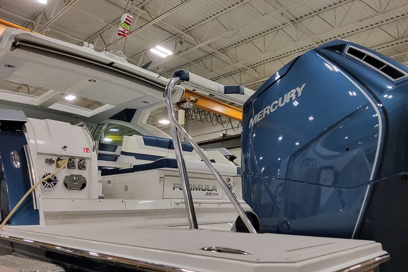 Slide: The Image of 2026 Formula 380 Super Sport Crossover OB with Mercury engine in a showroom. - 35