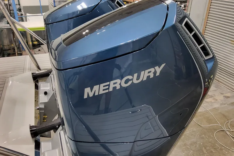 Slide: The Image of 2026 Formula 380 Super Sport Crossover OB with Mercury outboard engines in a workshop. - 36