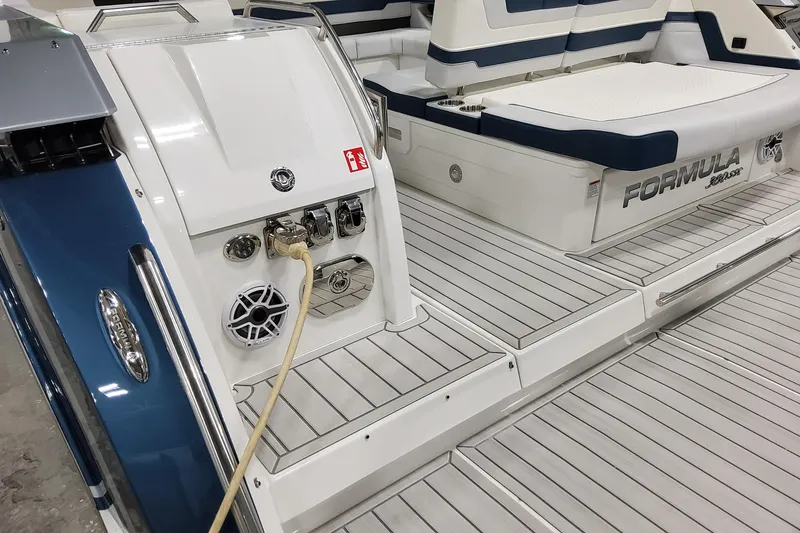 Slide: The Image of 2026 Formula 380 Super Sport Crossover OB boat with sleek deck and modern features. - 40