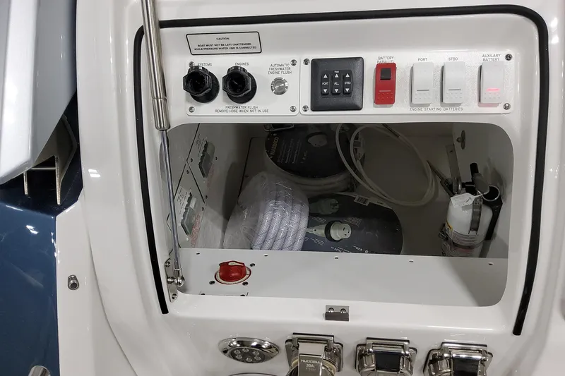 Slide: The Image of Control panel of 2026 Formula 380 Super Sport Crossover OB boat, featuring switches and storage. - 43