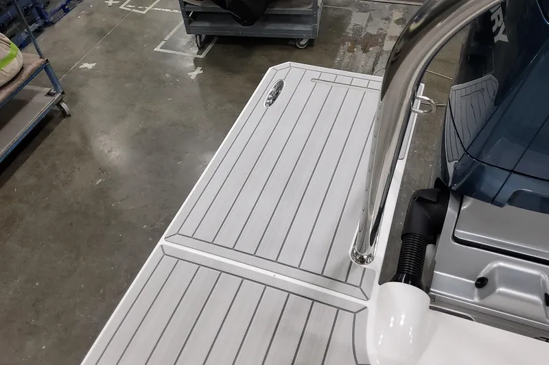 Slide: The Image of 2026 Formula 380 Super Sport Crossover OB boat deck with sleek design and metallic railing. - 44