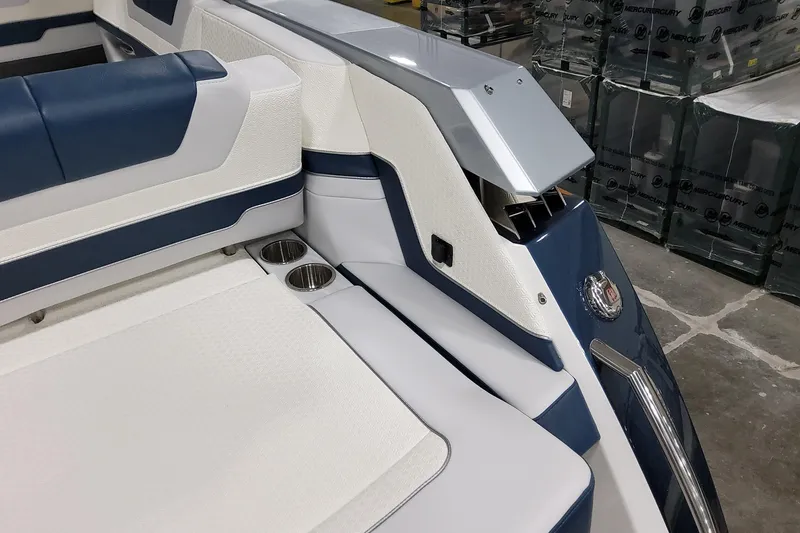 Slide: The Image of 2026 Formula 380 Super Sport Crossover OB interior with blue and white seating and cup holders. - 45