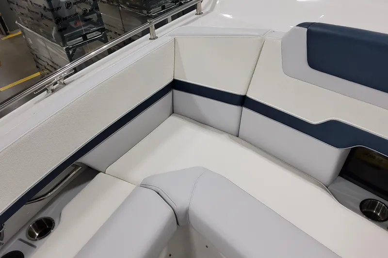 Slide: The Image of 2026 Formula 380 Super Sport Crossover OB boat interior with white and blue seating. - 58