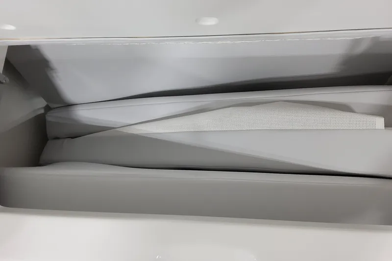 Slide: The Image of Storage compartment in 2026 Formula 380 Super Sport Crossover OB boat, featuring cushioned interior. - 65