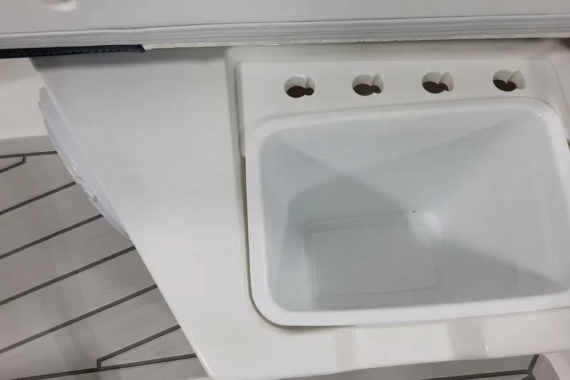 Slide: The Image of 2026 Formula 380 Super Sport Crossover OB boat interior with built-in storage compartment. - 66