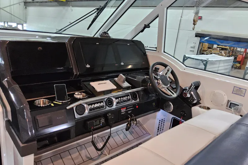 Slide: The Image of 2026 Formula 380 Super Sport Crossover OB helm with advanced controls and navigation displays. - 7