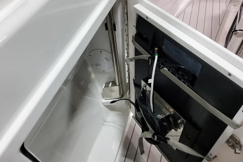 Slide: The Image of Interior view of 2026 Formula 380 Super Sport Crossover OB, showcasing storage compartment and wiring. - 72