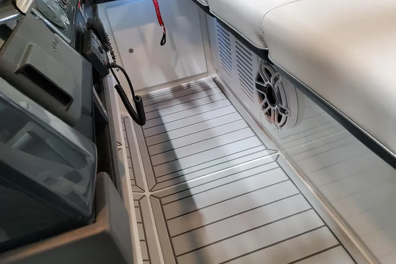 Slide: The Image of 2026 Formula 380 Super Sport Crossover OB interior with sleek flooring and speaker system. - 82