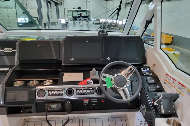 Slide: The Image of 2026 Formula 380 Super Sport Crossover OB helm with modern controls and navigation displays. - 83