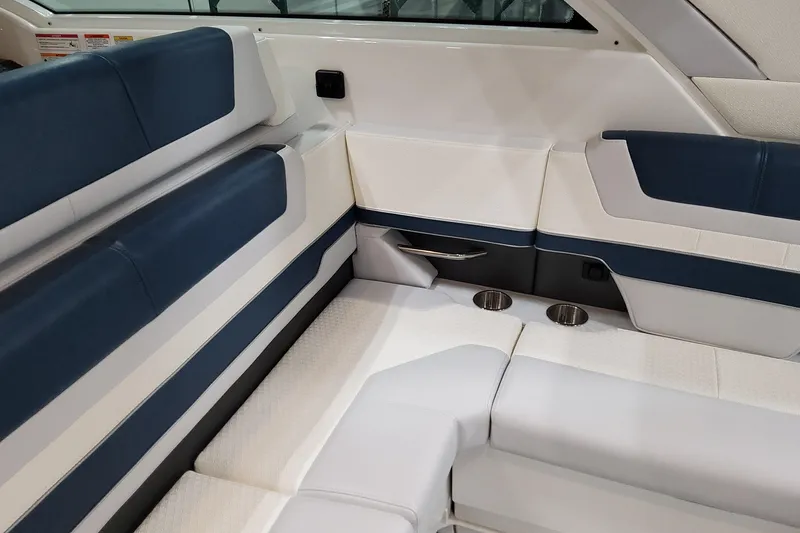 Slide: The Image of Luxurious seating in 2026 Formula 380 Super Sport Crossover OB boat interior, featuring cup holders. - 92