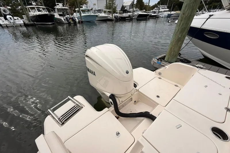 Slide: The Image of 2025 Grady-White Freedom 235 boat with Yamaha outboard motor at marina. - 13