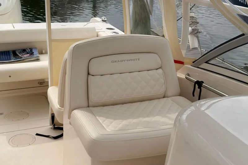 Slide: The Image of 2025 Grady-White Freedom 235 boat interior with luxurious seating and elegant design. - 8