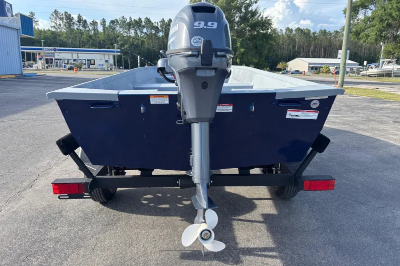 Slide: The Image of 2025 G3 Guide V16 XT boat with Yamaha 9.9 motor on trailer. - 13