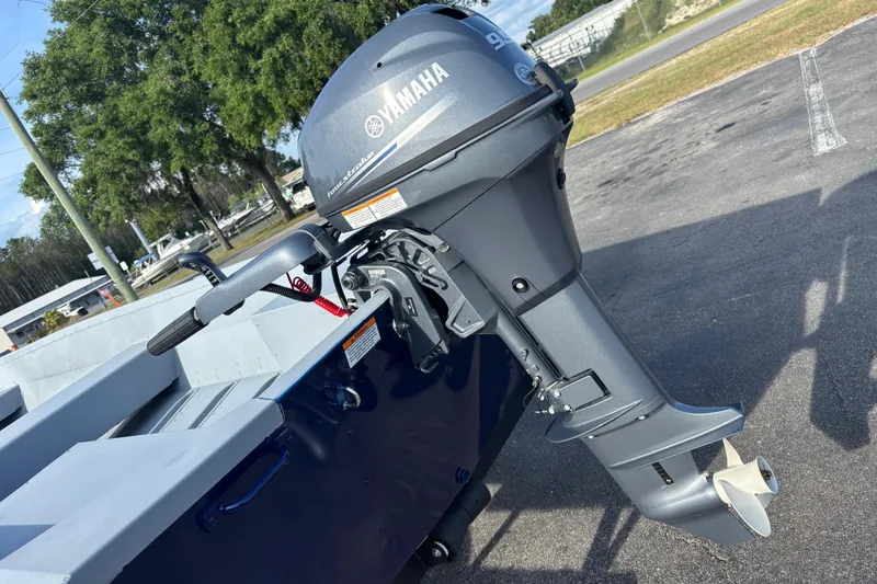 Slide: The Image of 2025 G3 Guide V16 XT boat with Yamaha outboard motor in a parking lot. - 15