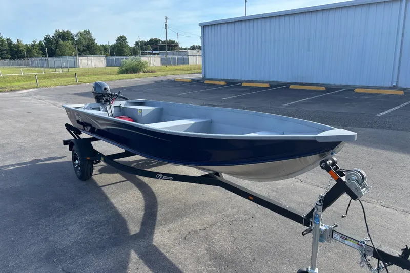 Slide: The Image of 2025 G3 Guide V16 XT boat on trailer in parking lot. - 3