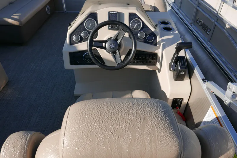 Slide: The Image of Steering console of 2018 Sweetwater SW2086c boat with control panel and seating. - 12