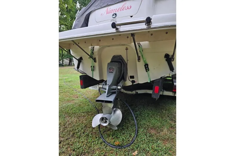 Slide: The Image of Rear view of 2002 Chaparral Signature 240 boat with visible propeller and trailer. - 3