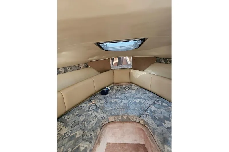 Slide: The Image of Interior cabin of 2002 Chaparral Signature 240 boat with patterned upholstery. - 7