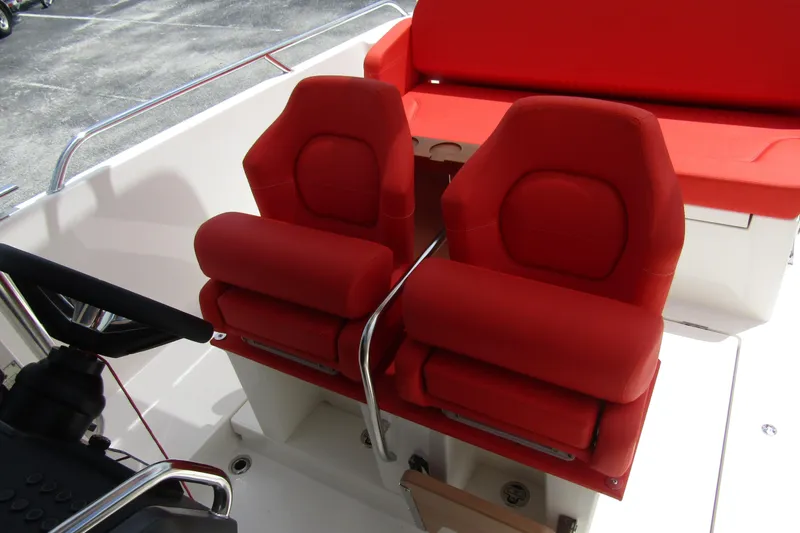 Slide: The Image of Red seats on 2024 Nimbus T8 boat, featuring modern design and comfortable seating. - 14