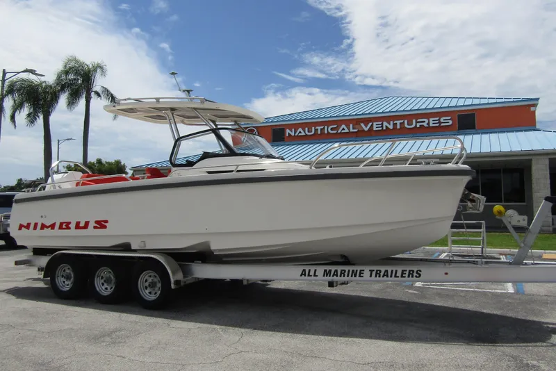 Slide: The Image of 2024 Nimbus T8 boat on trailer at Nautical Ventures dealership. - 5