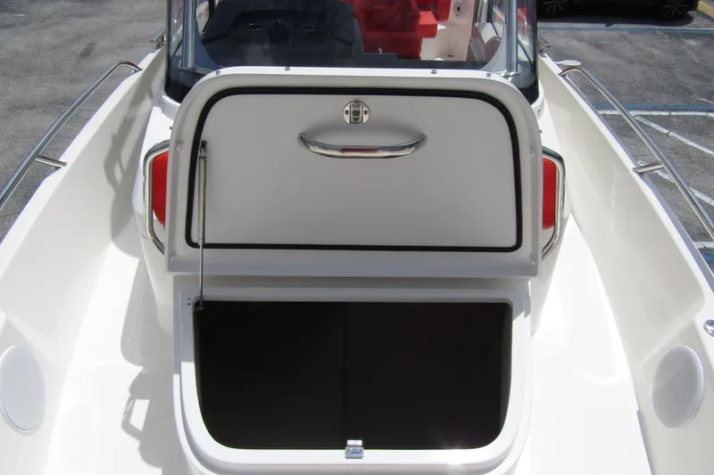 Slide: The Image of 2024 Nimbus T8 boat with open storage compartment, sleek design, and modern features. - 12