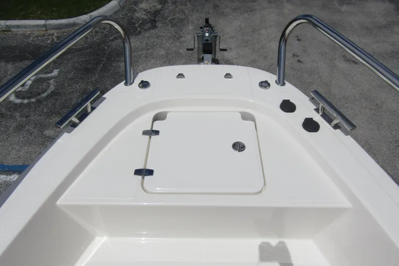 Slide: The Image of 2024 Nimbus T8 boat deck with storage compartment and stainless steel railings. - 8