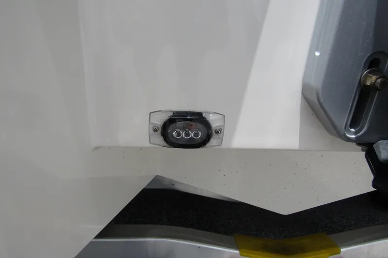 Slide: The Image of 2024 Nimbus T8 boat detail showing a small light fixture on the hull. - 7