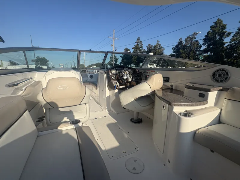 Slide: The Image of 2013 Rinker Captiva 276 boat interior with spacious seating and modern design. - 13