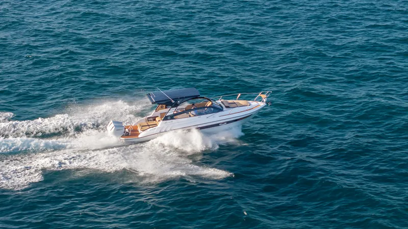 Slide: The Image of Hanover 305 yacht cruising on open sea, 2025 model. - 11