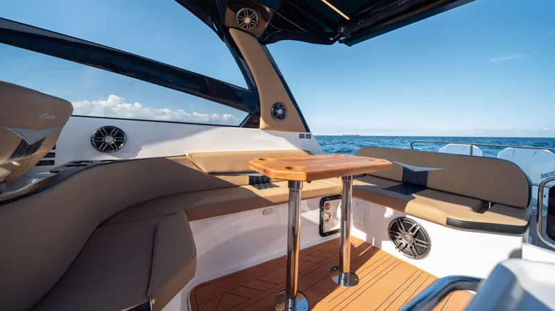 Slide: The Image of Luxurious 2025 Hanover 305 boat interior with seating and ocean view. - 22