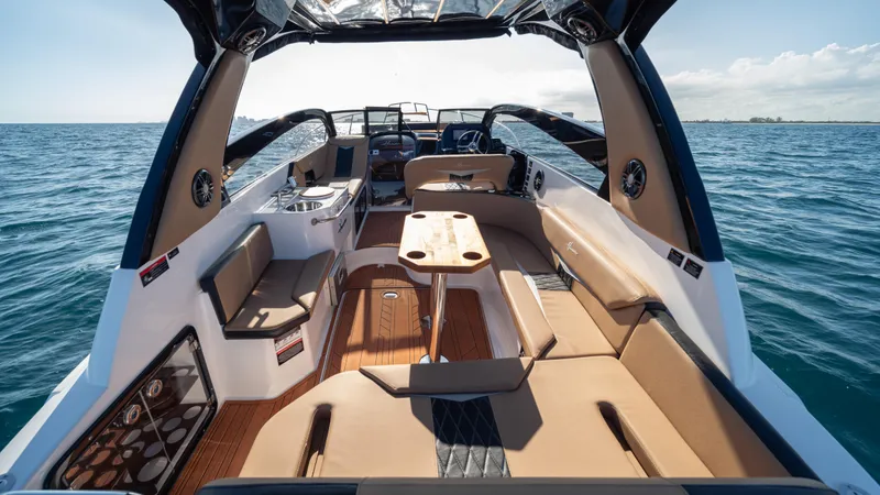Slide: The Image of Luxurious 2025 Hanover 305 boat interior with spacious seating and ocean view. - 23