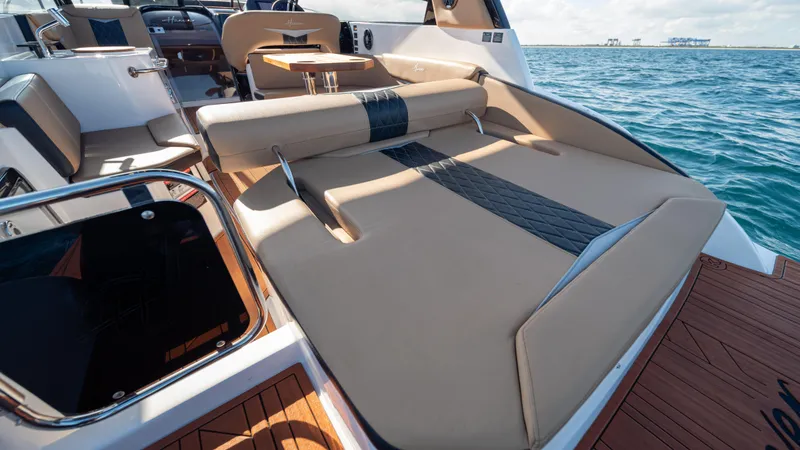 Slide: The Image of Luxurious Hanover 305 boat interior, 2025 model, with spacious seating and ocean view. - 24