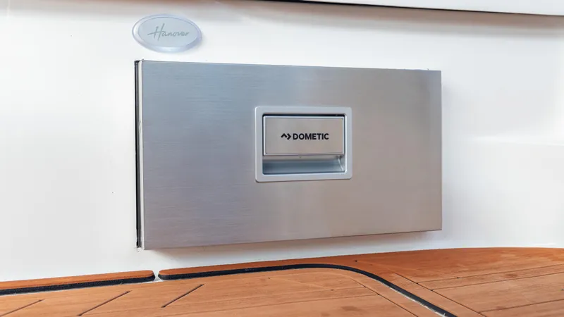 Slide: The Image of Hanover 305 boat with Dometic panel, 2026 model, featuring sleek design and wooden deck. - 40