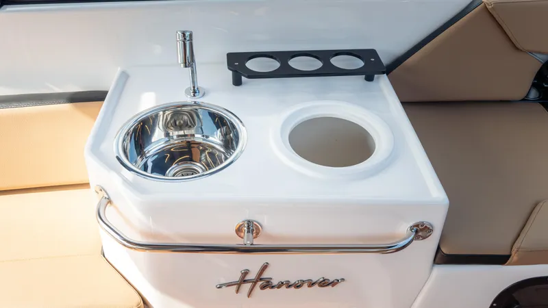 Slide: The Image of Hanover 305 boat interior with sink and cup holders, 2026 model. - 46