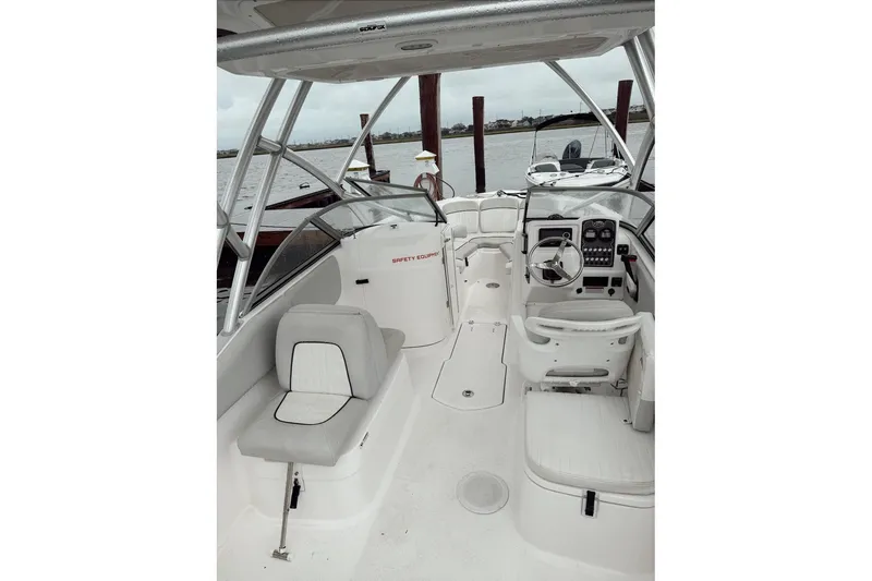 Slide: The Image of 2022 Seafox 226 Traveler boat interior with seating and steering console. - 4